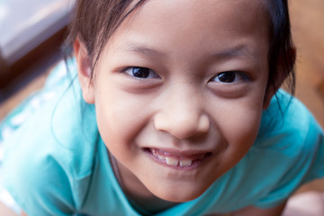 Happy asian child girl smiling and laughing