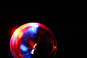 Red, blue and white light radiating out in a sphere