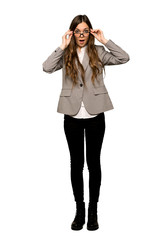 Full-length shot of Business woman with glasses and surprised on isolated white background