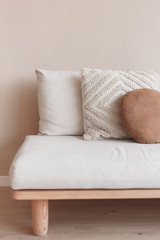 White square pillow on white sofa