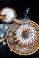 Big round cupcake, cake, pie, with cottage cheese, with rum, with raisins, with candied fruits, with icing sugar, Christmas, Easter, family traditions, homemade, panettone. -