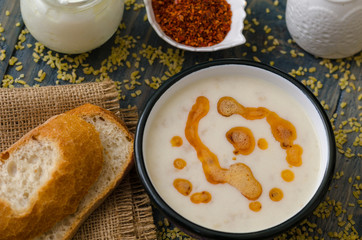 Tasty traditional soup on wooden table