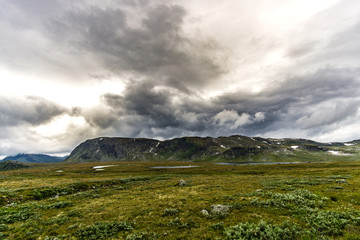 Light and shade, dramatic skies, mists and mountains, clouds in landscape in Norway