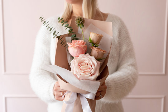 Woman Holding A Bouquet Of Roses