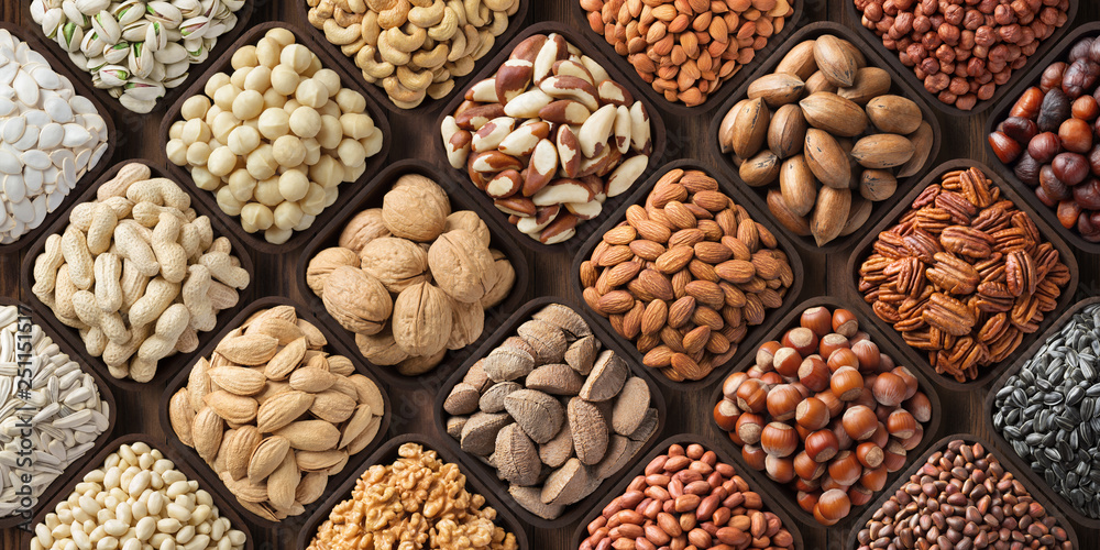 Wall mural assorted nuts background, large mix seeds. raw food products: pecan, hazelnuts, walnuts, pistachios, - Wall murals