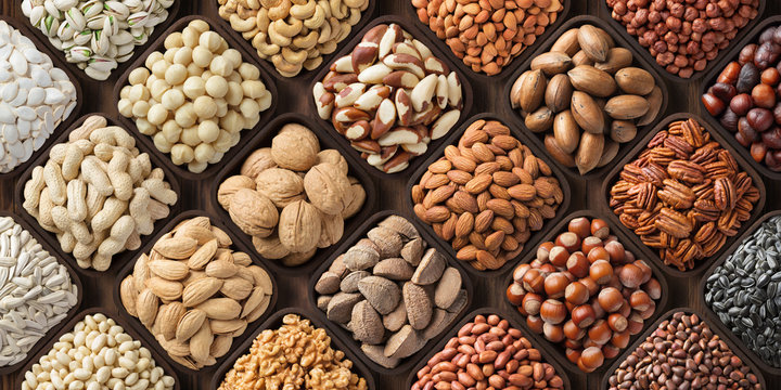assorted nuts background, large mix seeds. raw food products: pecan, hazelnuts, walnuts, pistachios, almonds, macadamia, cashew, peanut and other