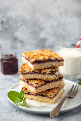 berries jam squares and glass of milk