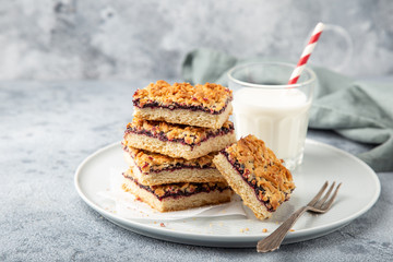 berries jam squares and glass of milk
