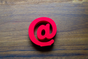 Email symbol on wooden background concept for internet, contact and e-mail address
