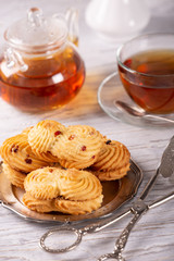 Fresh tasty cookies and hot tea on the table
