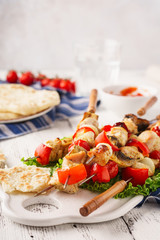 Chicken kebabs on skewers with mushrooms, bell peppers, onions.