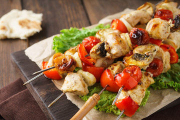 Grilled chicken or turkey skewers with mushrooms and vegetables.
