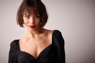Fototapeta premium Attractive young woman studio portrait