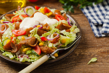 Gyros, kebeb. Salad with mutton and vegetables.