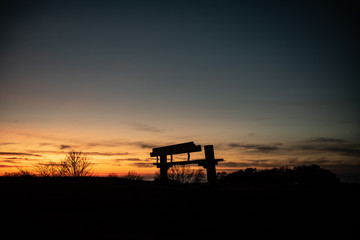 Fototapeta premium Bench with a view. Sunset. House of Knud Rasmussen, Hundested.