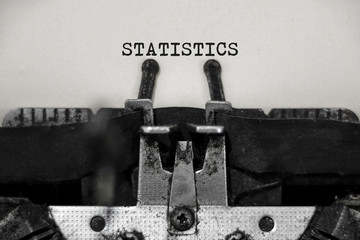 Statistics word with black and white typewriter concept