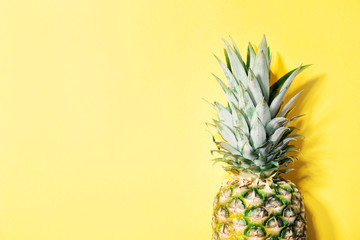 Pineapple on yellow color background
