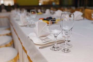 Crystal dishes on a restaurant table, open background.