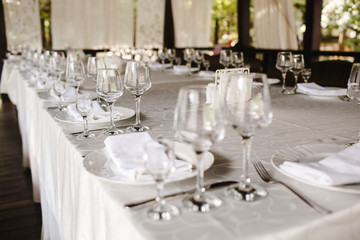 Crystal dishes on a restaurant table, open background.