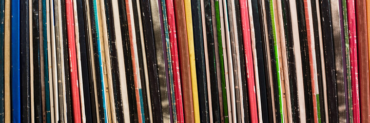 Collection of vinyl records covers panoramic background, vintage music concept