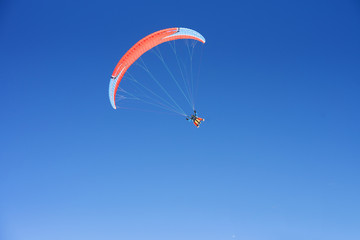 Paragliding, cloudless blue sky