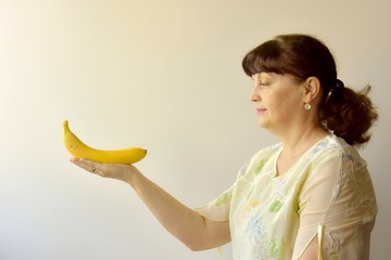 woman holding a banana