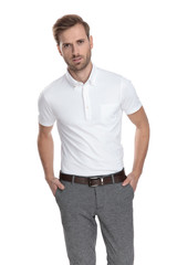 Fototapeta premium relaxed casual man standing with hands in pockets