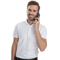 happy young casual man is talking on his mobile phone