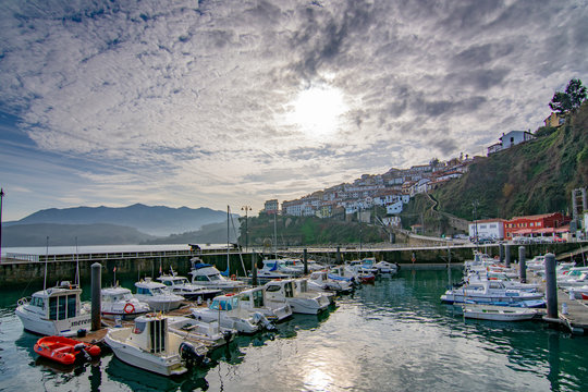 view of the boats in a port in Lastres Asturias, Spain