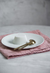 Vegan coconut Raspberry panna cotta decorated with ripe berry