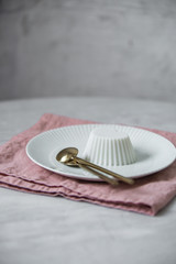 Vegan coconut Raspberry panna cotta decorated with ripe berry