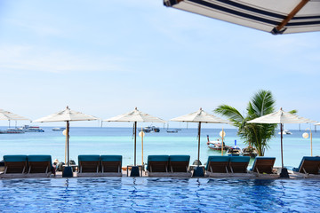 Beach Chairs and swimming pool on the beach beautiful