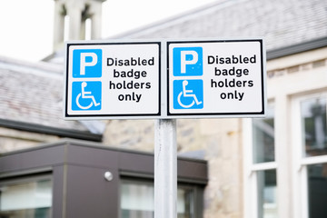 Disabled Badge Holders Only at Car Park Sign Post