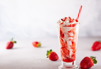 Strawberry milkshake with whipped cream.
