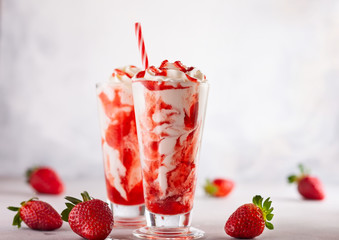 Strawberry milkshake with whipped cream.