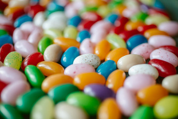 Fototapeta na wymiar Colorful candy beans as texture and background. Close up view of jelly beans with selective focus. 