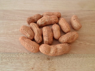 Peanuts On Wooden Board