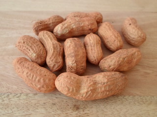 Peanuts On Wooden Board