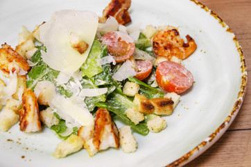 Shrimp Caesar salad with Parmesan cheese, croutons and lettuce