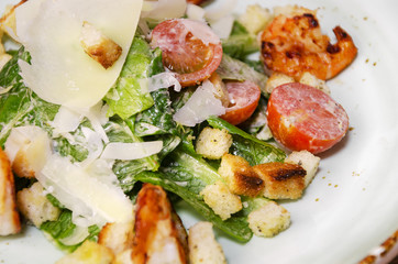 Shrimp Caesar salad with Parmesan cheese, croutons and lettuce