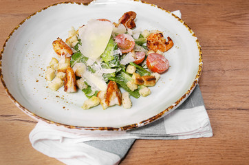 Shrimp Caesar salad with Parmesan cheese, croutons and lettuce