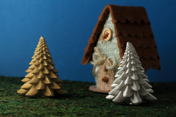 toy fir trees near a house