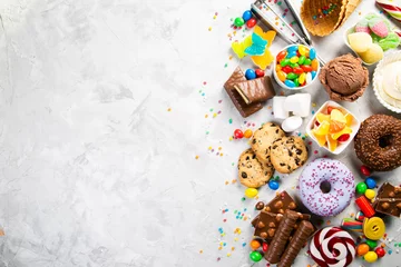 Fotobehang Selection of colorful sweets - chocolate, donuts, cookies, lollipops, ice cream top view © anaumenko