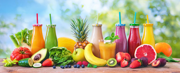 Colorful freshly squeezed fruits and vegetables smoothies with ingredients for healthy eating - obrazy, fototapety, plakaty