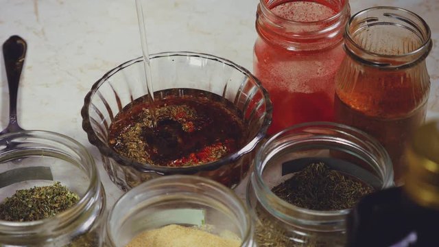the process of crafting a barbecue sauce with spices