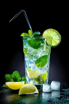 Naklejki Mojito cocktail with fresh lime and mint