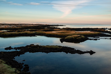 Fototapeta premium Sunset in Straumur in Hafnarfjordur, Iceland