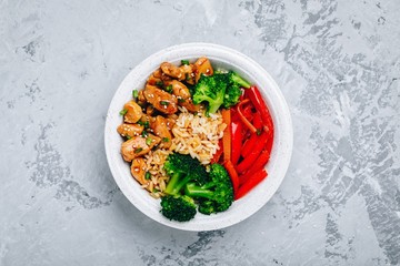 Teriyaki Chicken buddha bowl lunch with rice, broccoli and red bell pepper