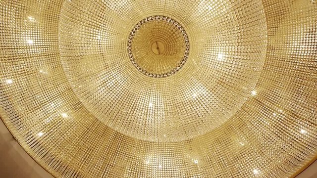 A very expensive chandelier in a chic restaurant or concert hall. Concept of luxury life. The video is suitable for the background