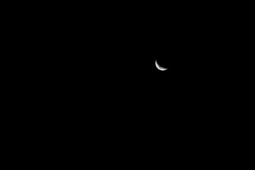 New moon. On the black sky.